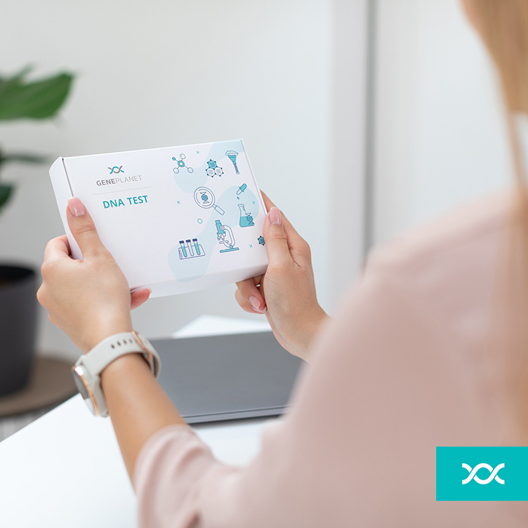 Woman holding the DNA test kit in her hands