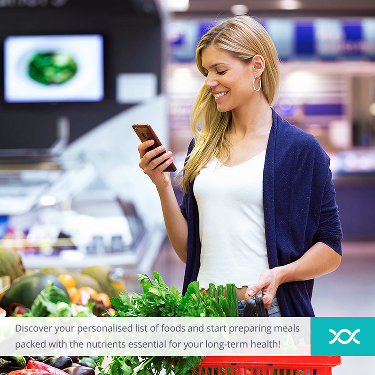 Woman checking her phone while doing grocery shopping