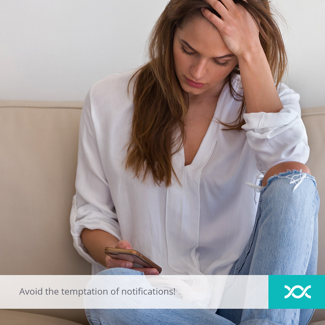 Upset young woman checking her phone