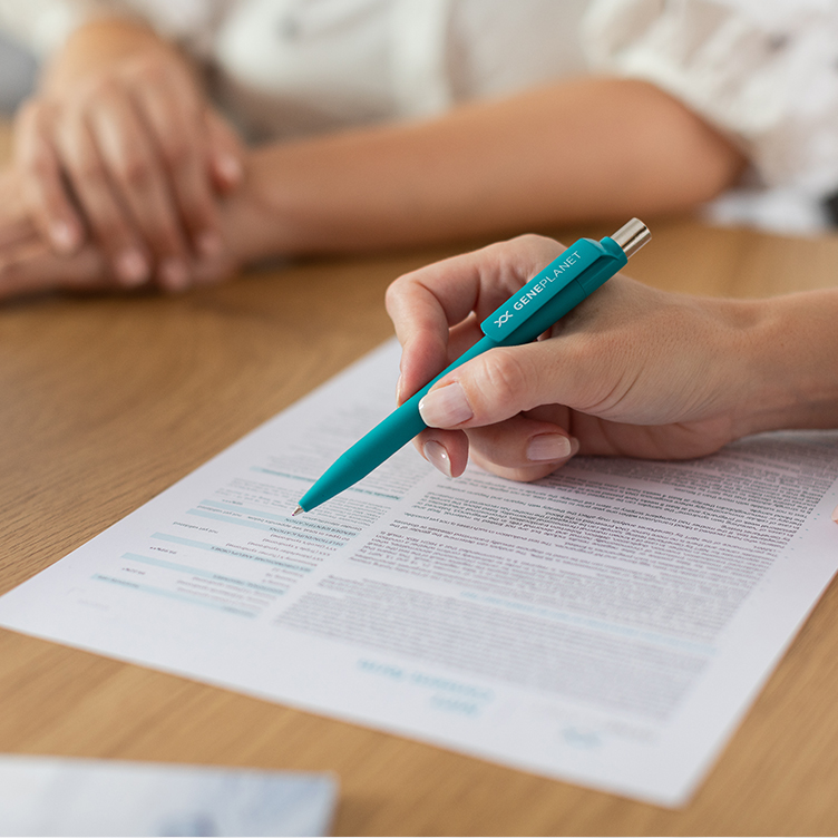 Doctor explaining the consent form of GenePlanet's NIPT test to a patient