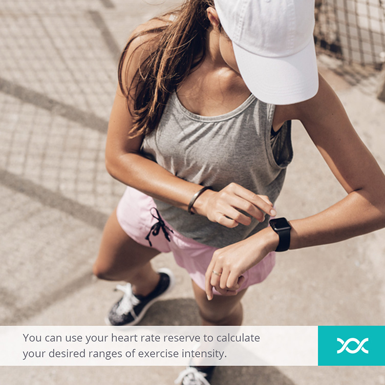 Girl setting her sport watch before starting to exercise